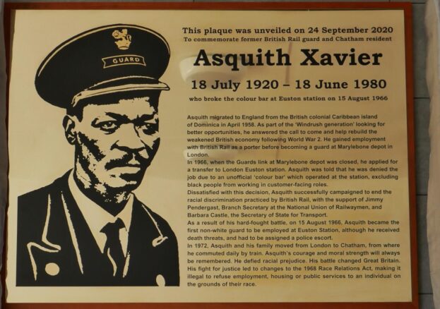 a placquard commemorating asquith xavier with an image of him in uniform and a paragraph about his life