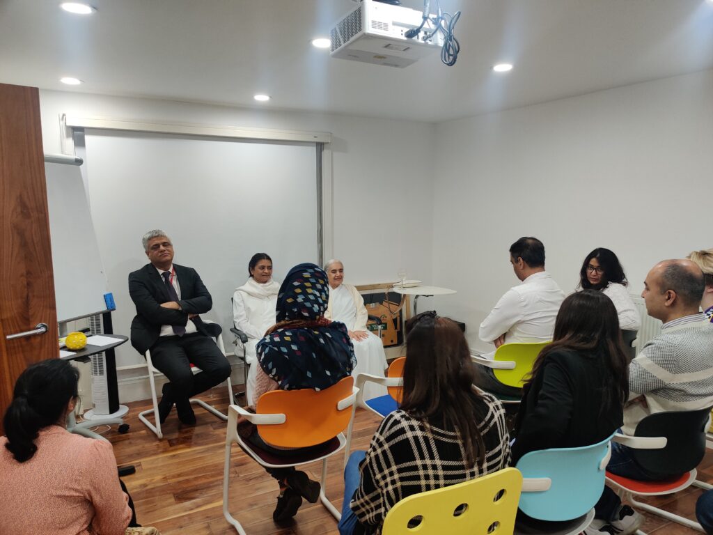 the here and now team listening to sister jayanti of the brahma kumaris talk